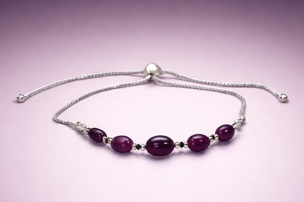 Bracelet with rubies on a light purple background