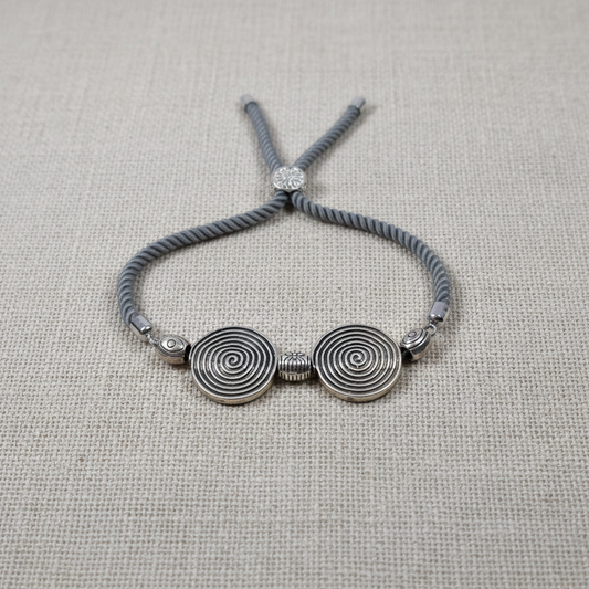 Spiral bracelet on linen